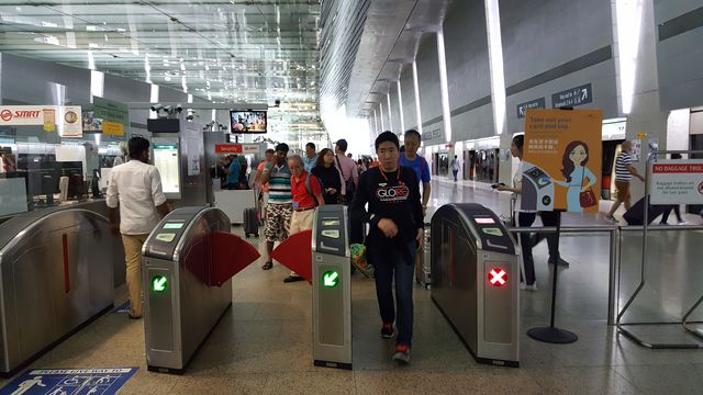 A view of Singapore's MRT, which utilizes gates, not turnstiles.